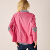 Back view of the rose pink tee with navy striped heart appliqué on sleeves.