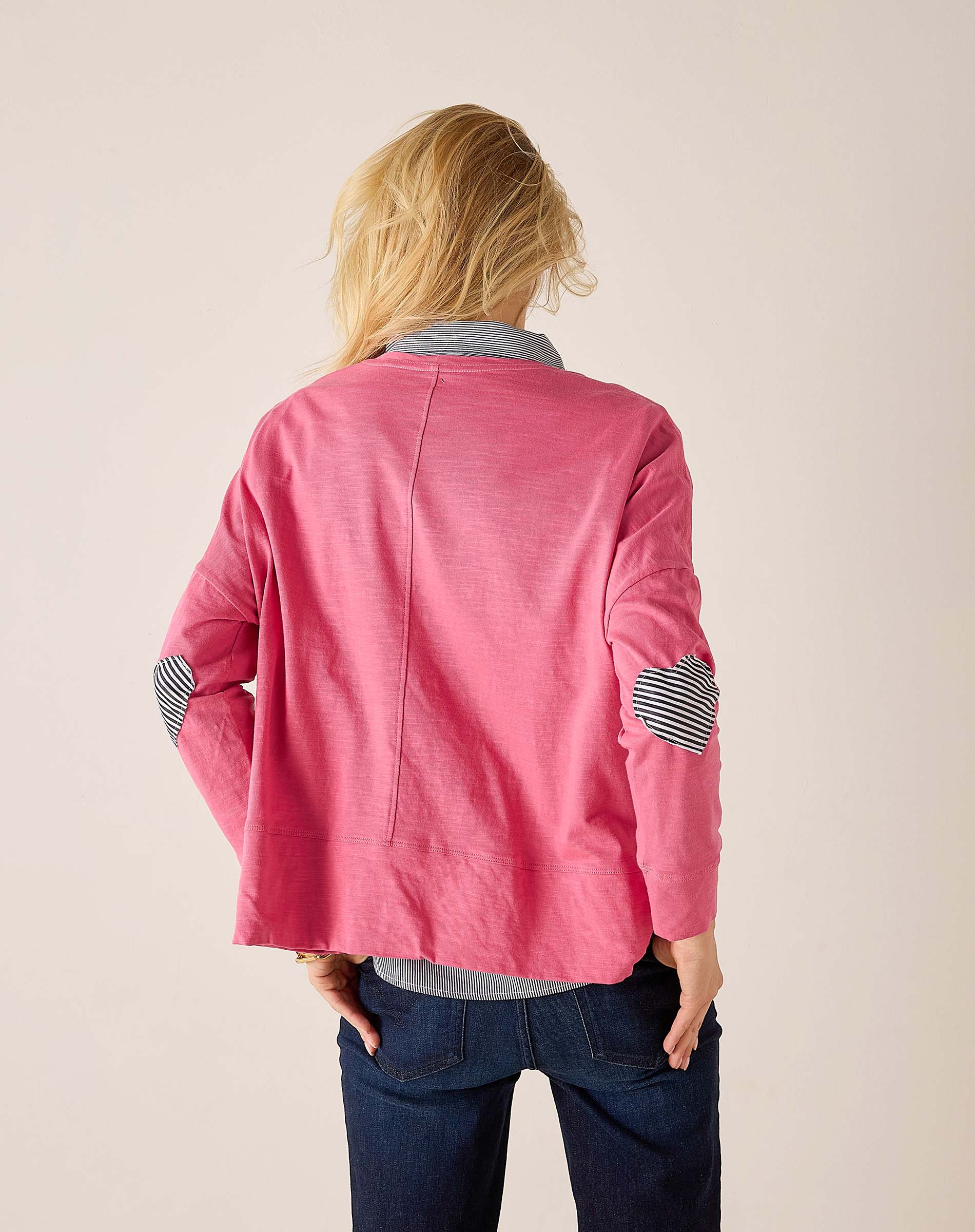 Back view of the rose pink tee with navy striped heart appliqué on sleeves.