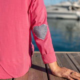 Rapture rose tee with a navy stripe heart applique on the sleeve.