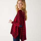 maroon sweater with red stripes and a navy heart elbow patch sideways on white background