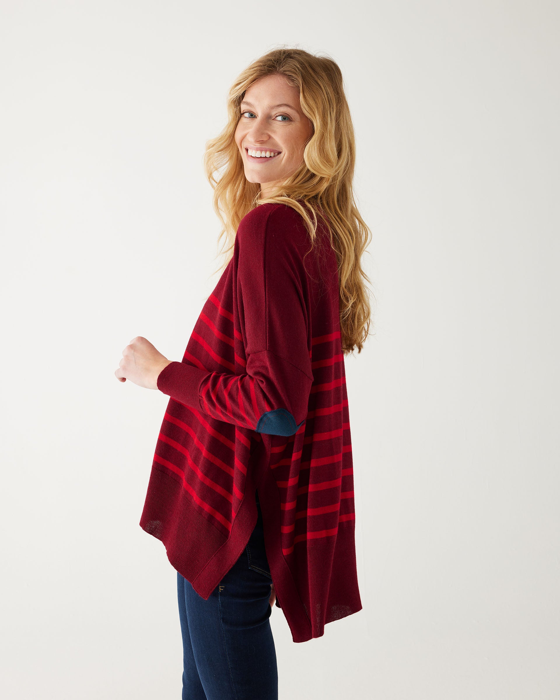 maroon sweater with red stripes and a navy heart elbow patch sideways on white background