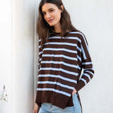 Chocolate icing and blue striped knit sweater with a relaxed fit and side slits.