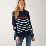 female wearing navy sweater with white stripes & red heart elbow patch on white background