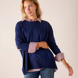 Ladies' travel-ready navy blue oversized knit sweater with stars and stripes patterned collar and cuffs.