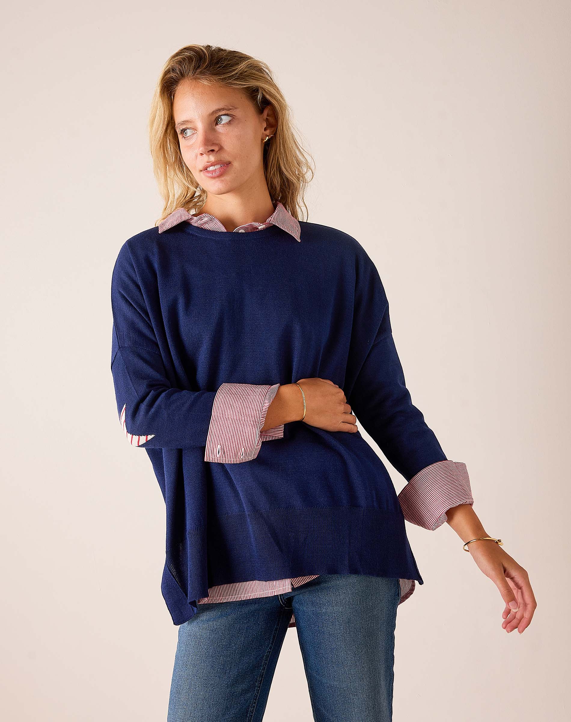 Ladies' travel-ready navy blue oversized knit sweater with stars and stripes patterned collar and cuffs.