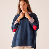 Navy blue oversized t-shirt featuring a striped collar, striped cuffs, and red heart accents on the sleeves.