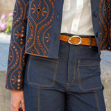 Rinse blue woven pant with contrast stitching and a tailored fit.