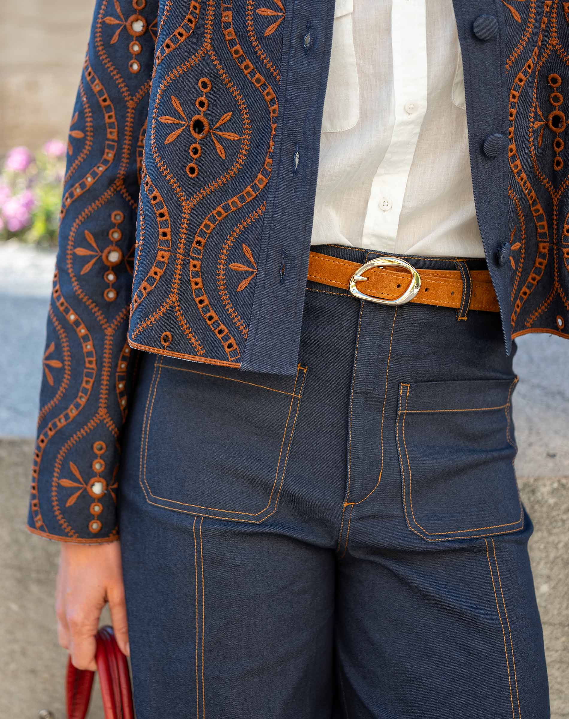 Rinse blue woven pant with contrast stitching and a tailored fit.