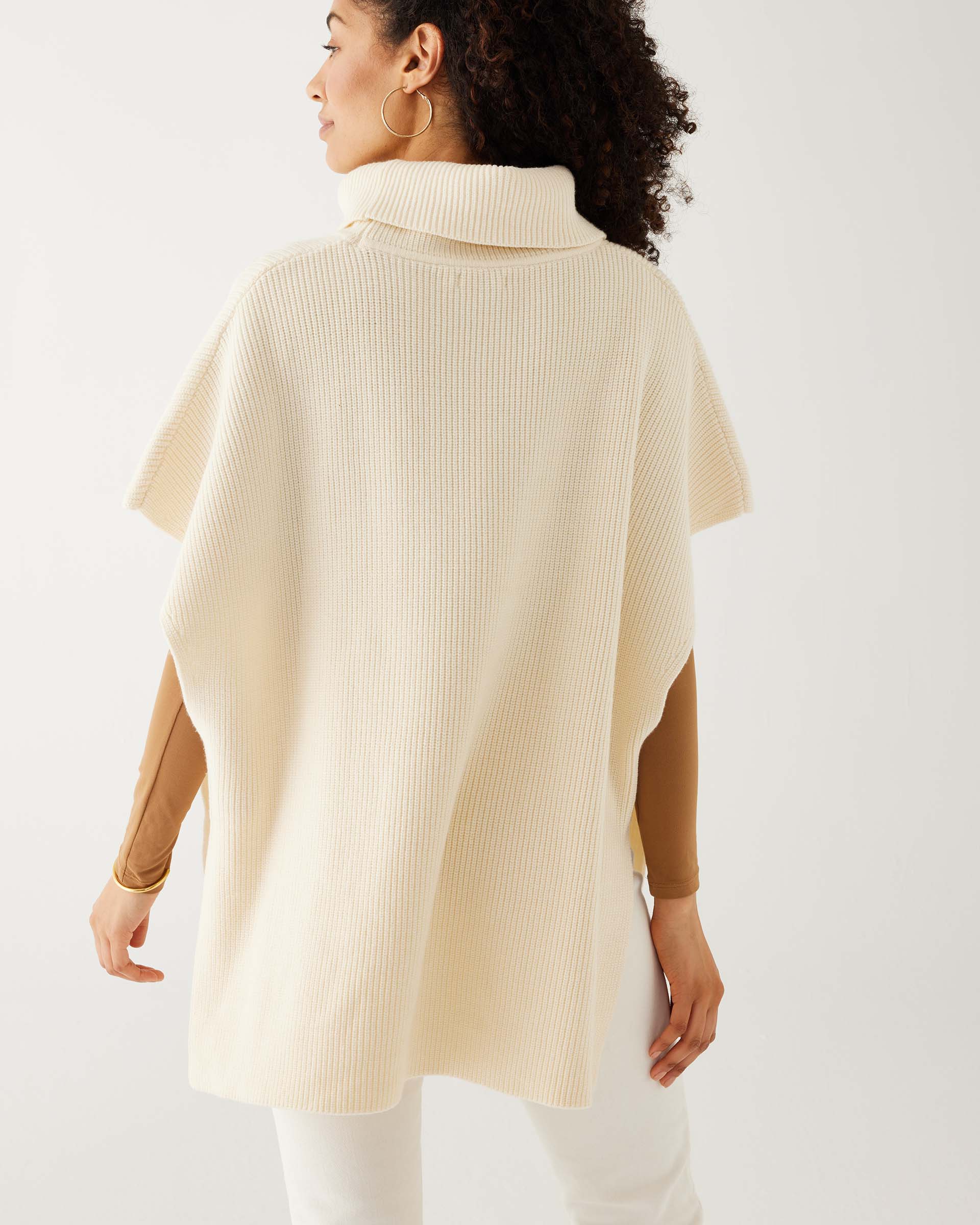 rearview of woman wearing Anywear sweater vest with open sides in winter wheat