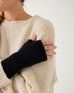 closeup of woman wearing mersea black apres fingerless gloves