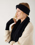 profile of woman wearing mersea black apres headband fingerless gloves and scarf