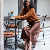 Chocolate brown satin-finish Arles skirt with a flowing silhouette.