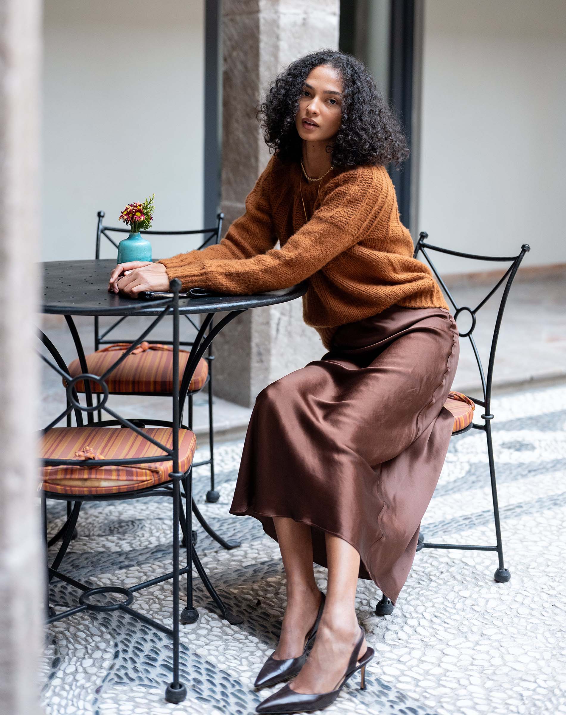 Chocolate brown satin-finish Arles skirt with a flowing silhouette.