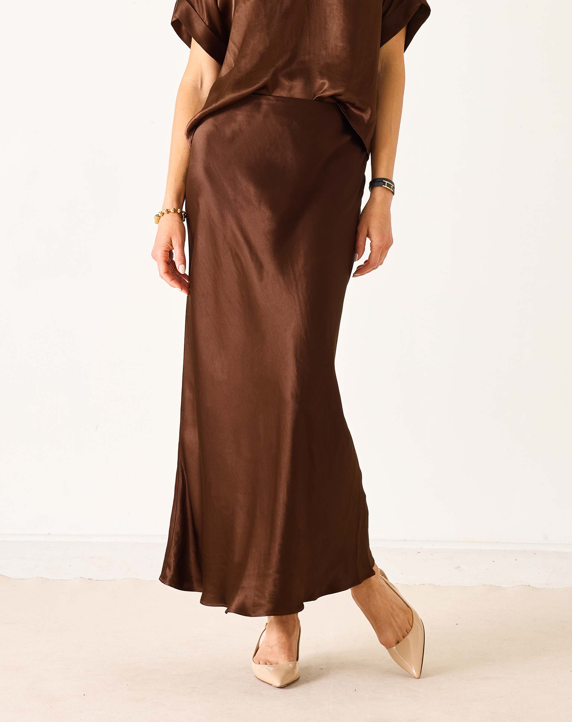 Chocolate brown silk-like satin midi skirt with a flowing drape.