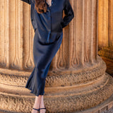 Women's travel-friendly navy blue satin-finish silk midi skirt with a gathered waist and flowing silhouette.