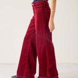 Merlot wide-leg pants in a corduroy texture with a high waist and wide legs.