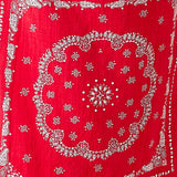 Red bandana with white paisley patterns