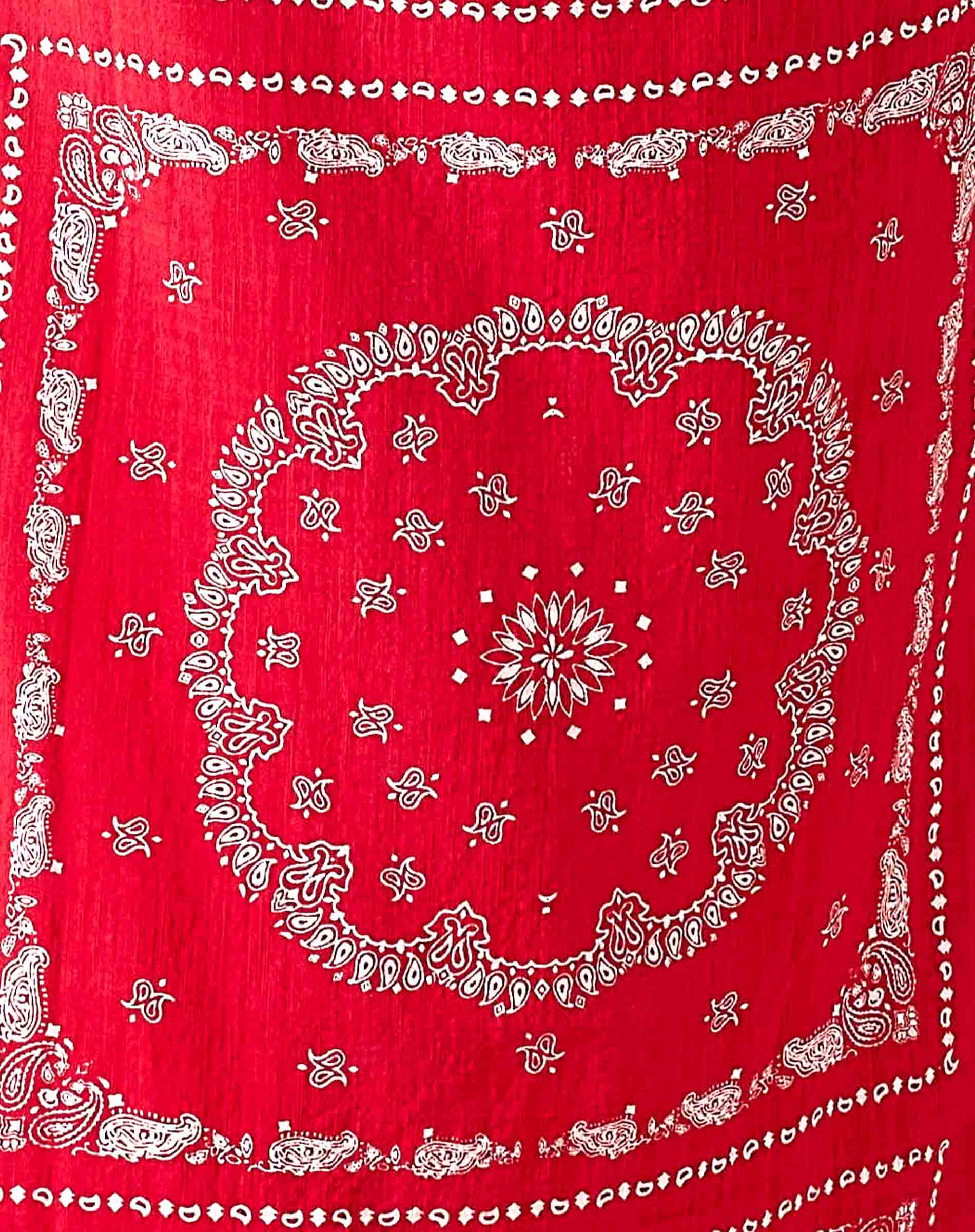 Red bandana with white paisley patterns