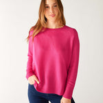 woman wearing mersea banff cashmere sweater in hot magenta 