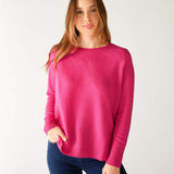 woman wearing mersea banff cashmere sweater in hot magenta 