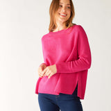 woman wearing mersea banff cashmere sweater in hot magenta