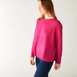 profile of woman wearing mersea banff cashmere sweater in hot magenta