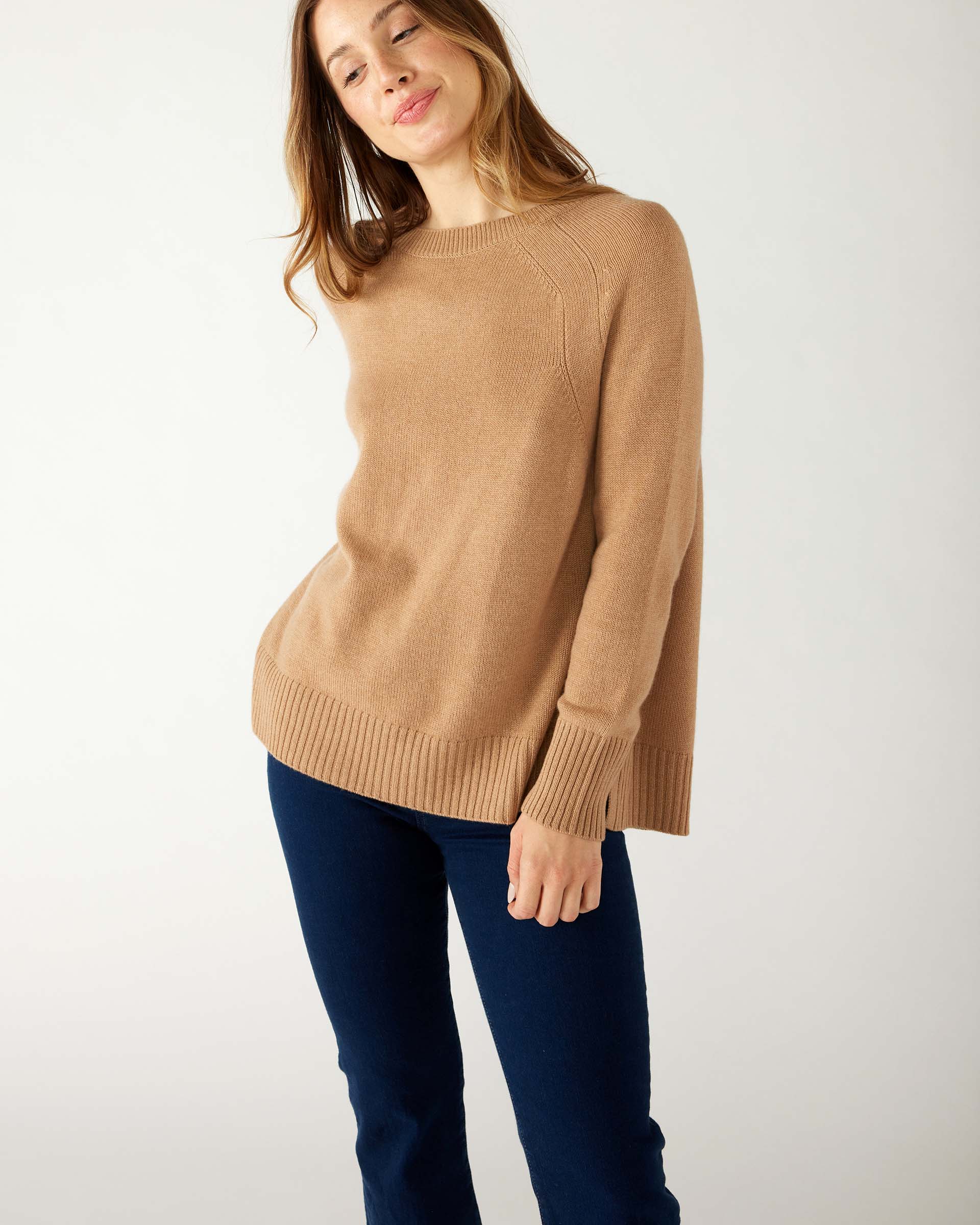 woman wearing mersea banff cashmere sweater in camel with hand on hip