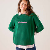 Green knit sweater with 'Weekenders' graphic text.