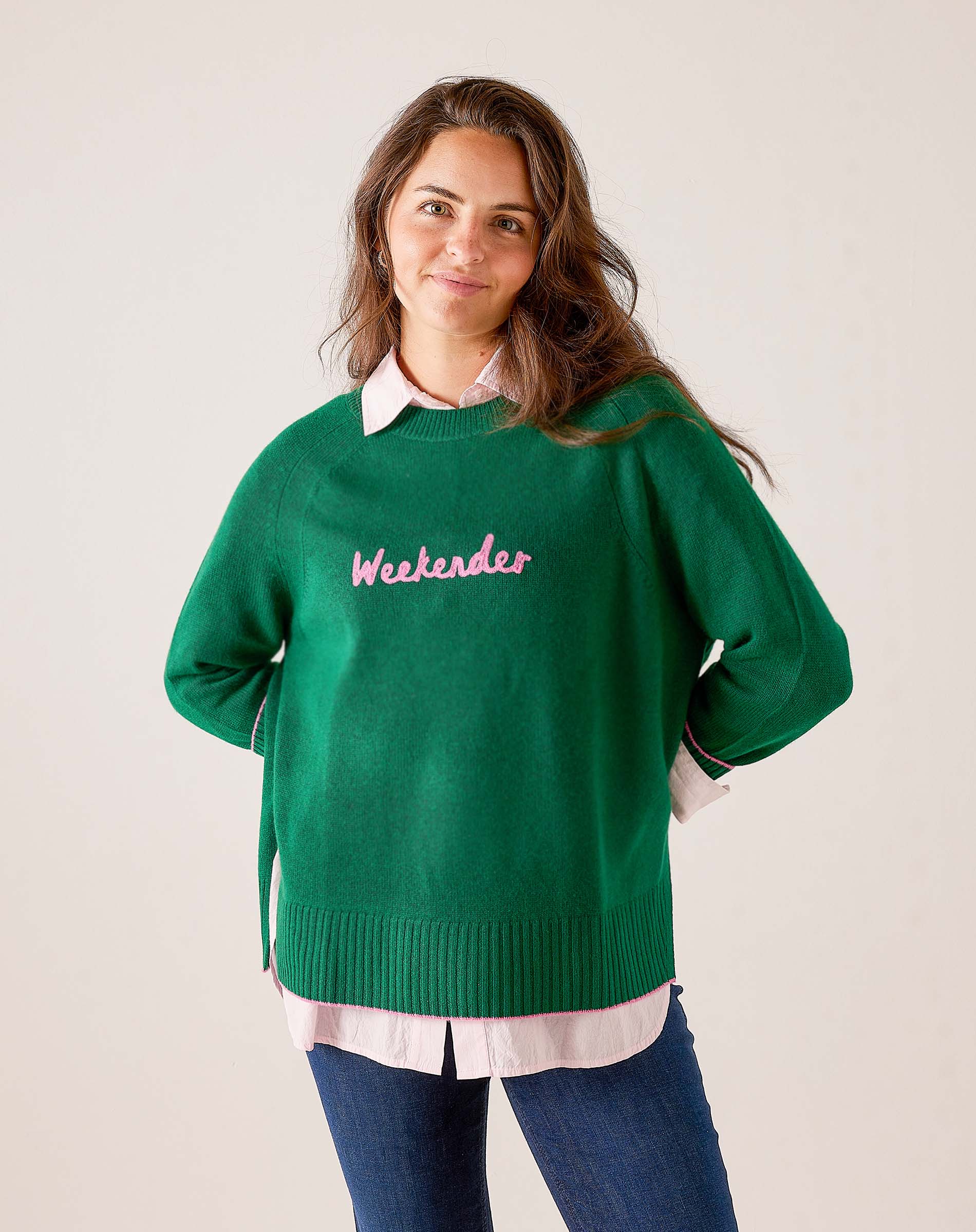 Green knit sweater with 'Weekenders' graphic text.