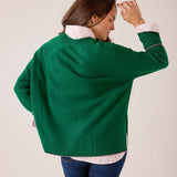 Emerald green oversized knit sweater with ribbed hem and cuffs
