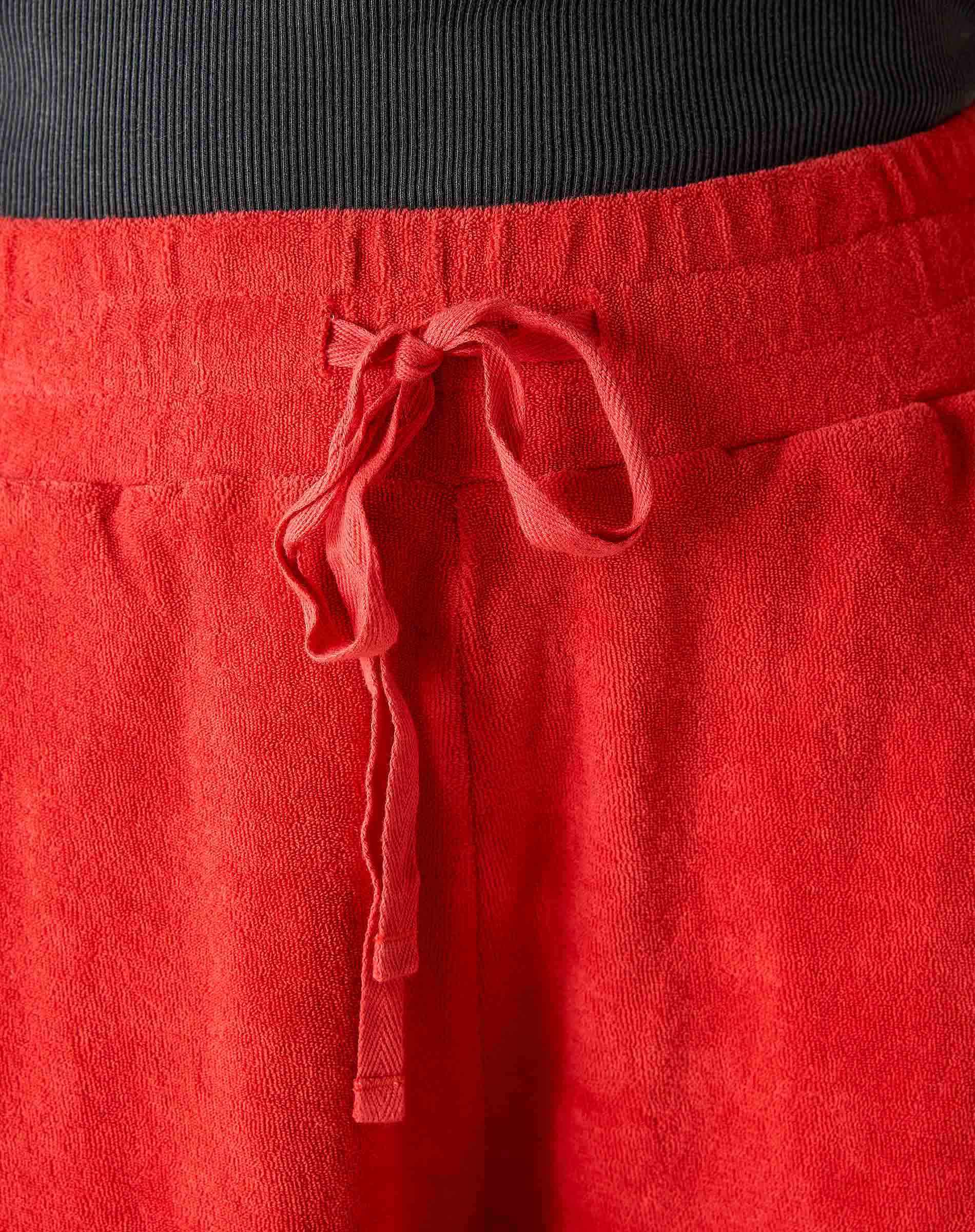 Close-up of red pants with a drawstring on a blurred background