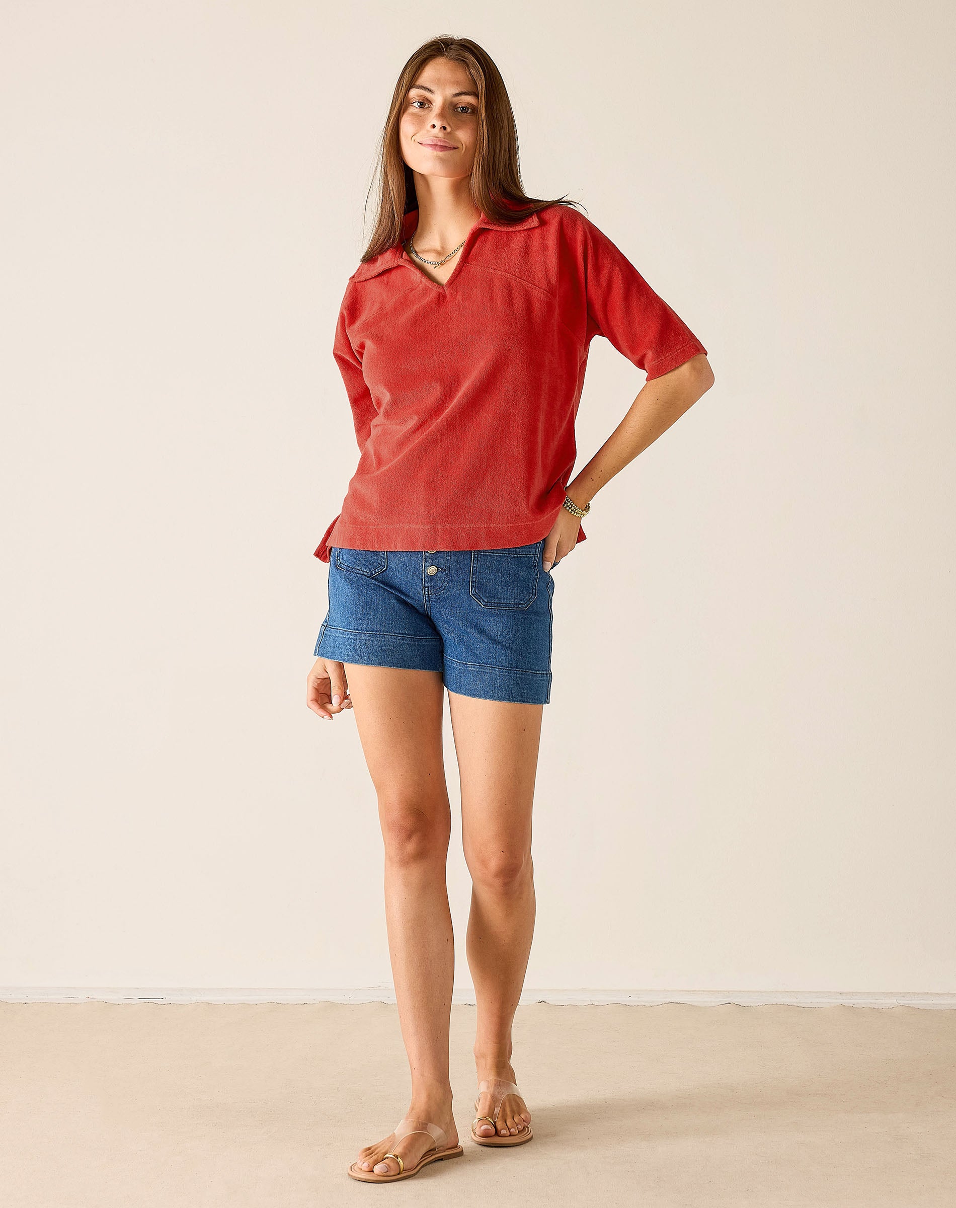 Ladies' travel-ready sunbaked terracotta knit beach club top with a V-neckline and short sleeves.