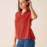 Sunbaked orange terry cloth top with a split neckline and relaxed fit.