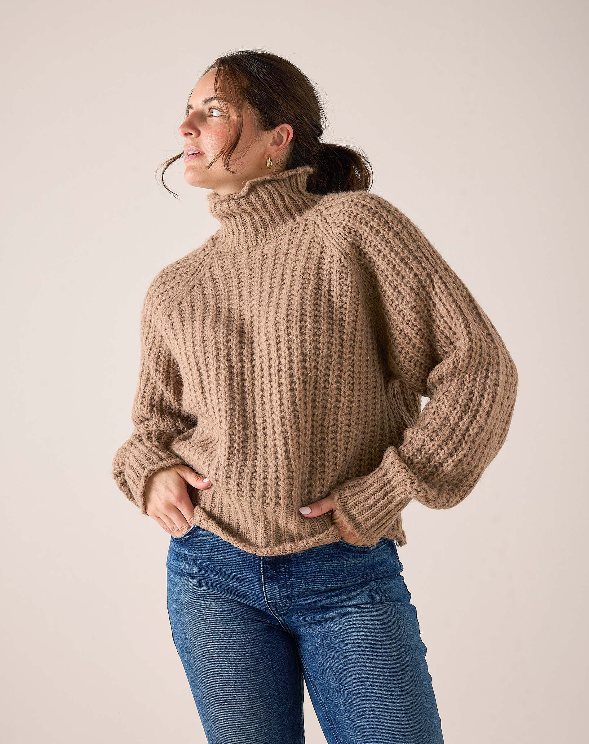 MERSEA ladies' travel-ready beachstone tan ribbed knit sweater with a turtleneck and balloon sleeves.