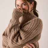 Beachstone tan cable knit turtleneck sweater with ribbed cuffs and a cozy oversized fit