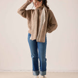 Oversized cable knit sweater in beachstone beige with a long draped back.