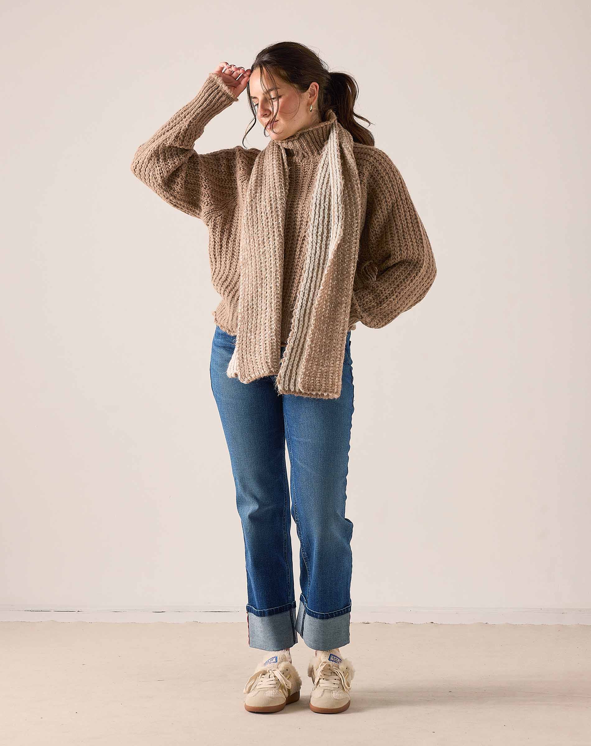 Oversized cable knit sweater in beachstone beige with a long draped back.
