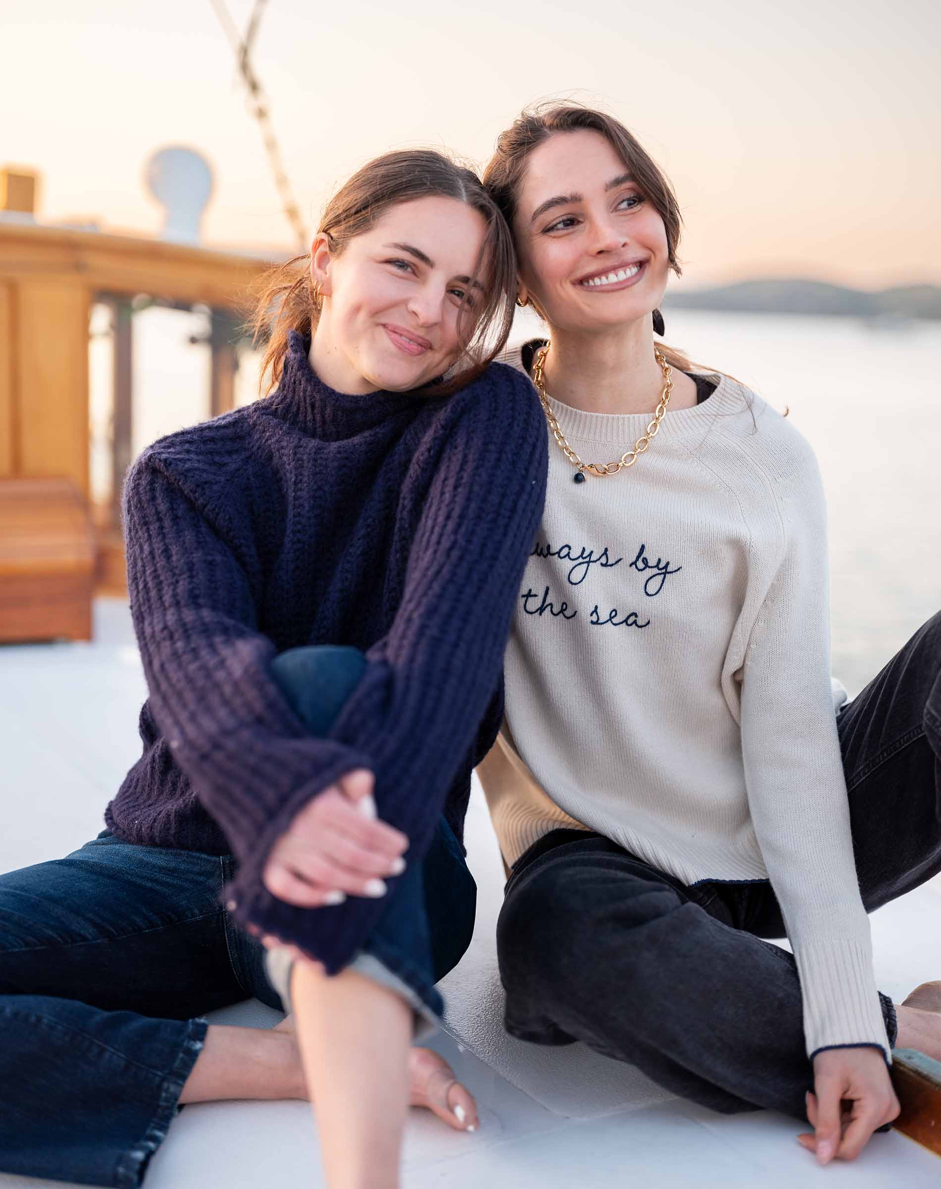 Ladies' travel-ready navy blue oversized knit sweater with ribbed details.