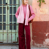 Pink sand ribbed knit sweater with a matching oversized scarf.