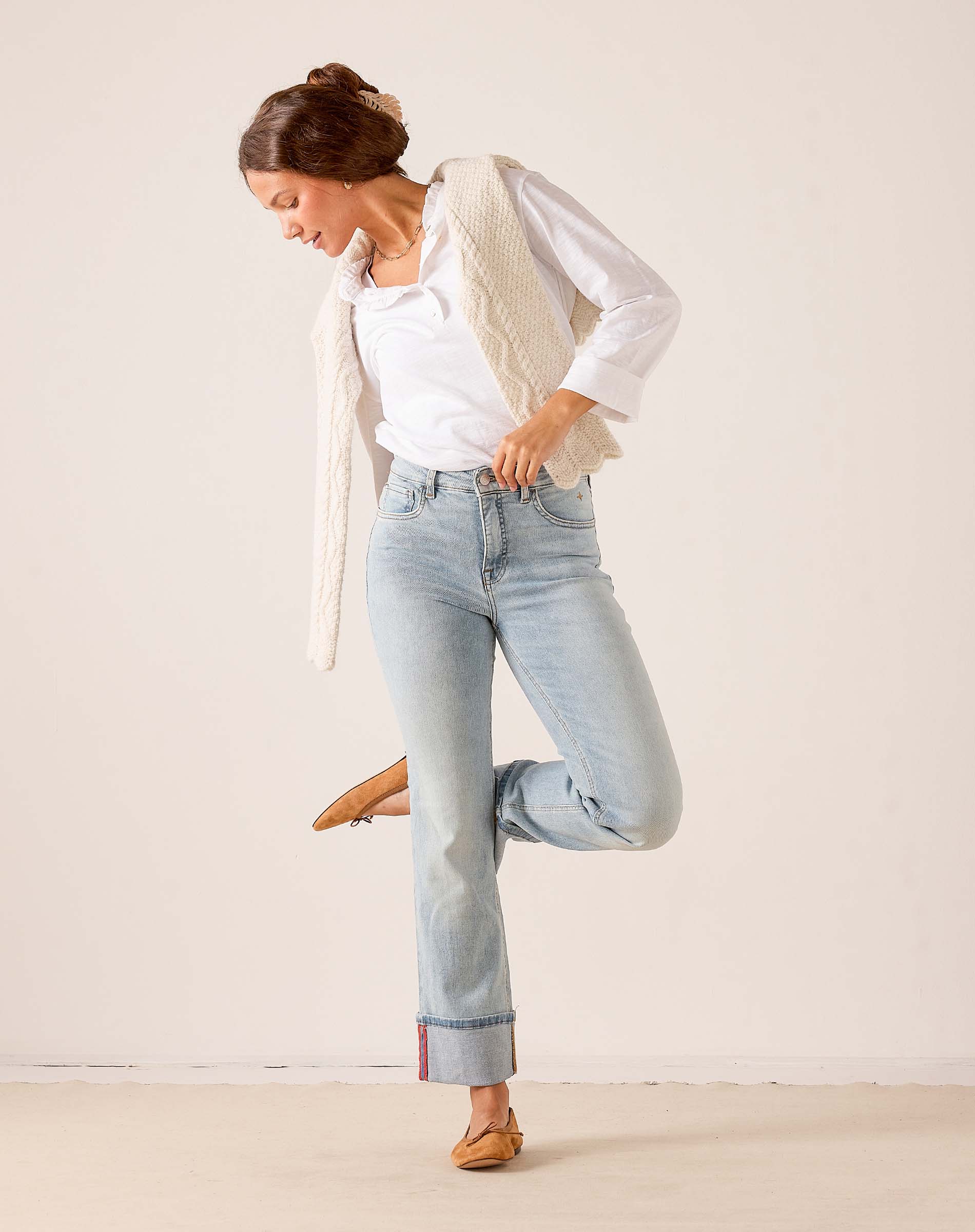 MERSEA women's travel-friendly cloud Nine light-wash blue straight-leg jeans with a unique stitched hem detail.