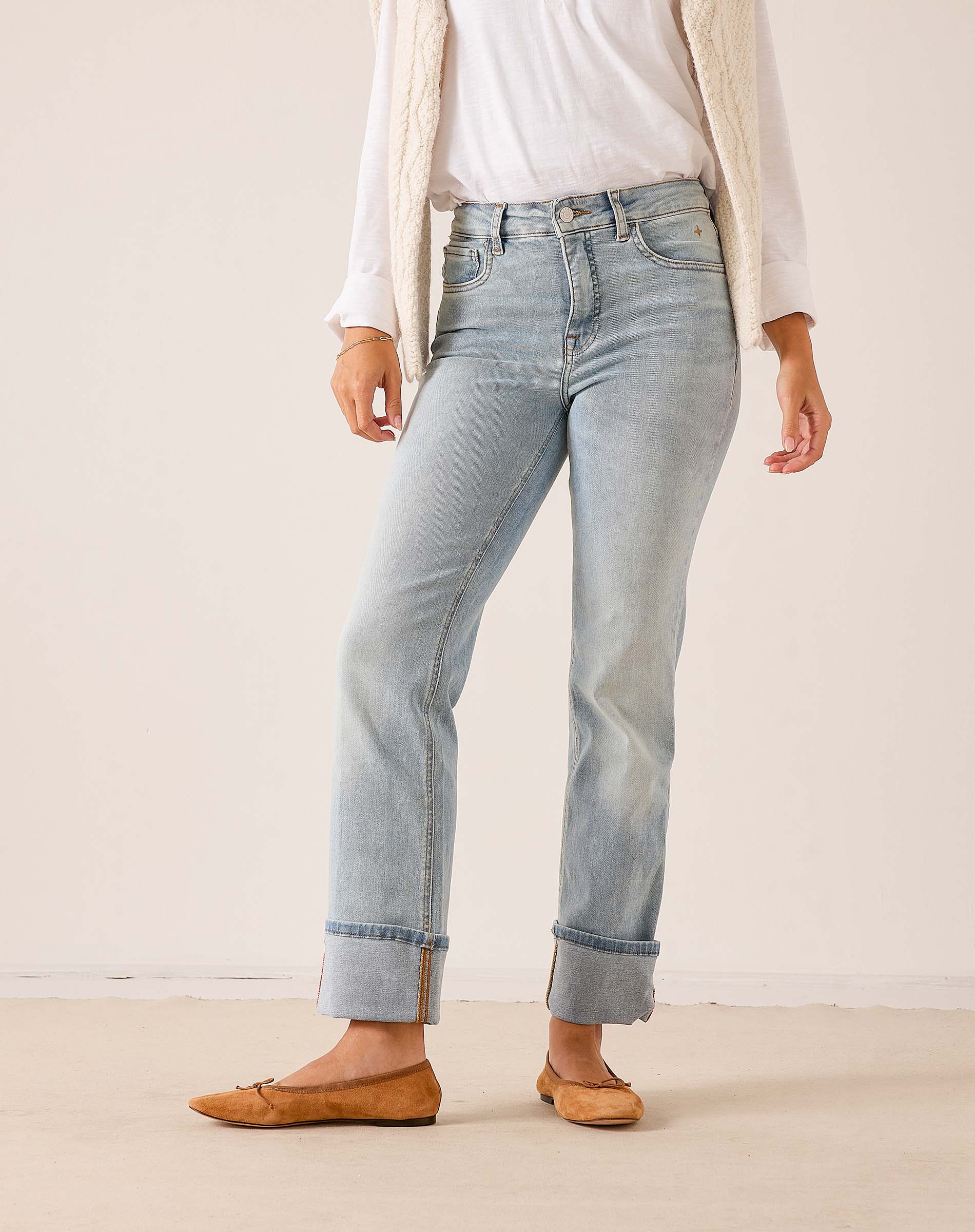 Light-wash blue straight-leg denim jeans with cropped hems and cuffed hems.