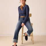 Women's travel-friendly faded indigo straight leg denim jeans with rolled hems.