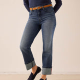Faded indigo straight-leg denim pants with rolled cuffs.