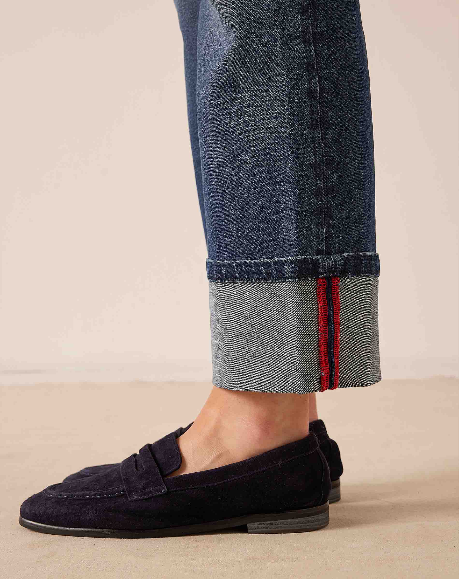 Faded indigo straight-leg denim pants with rolled cuffs and red stitching detail