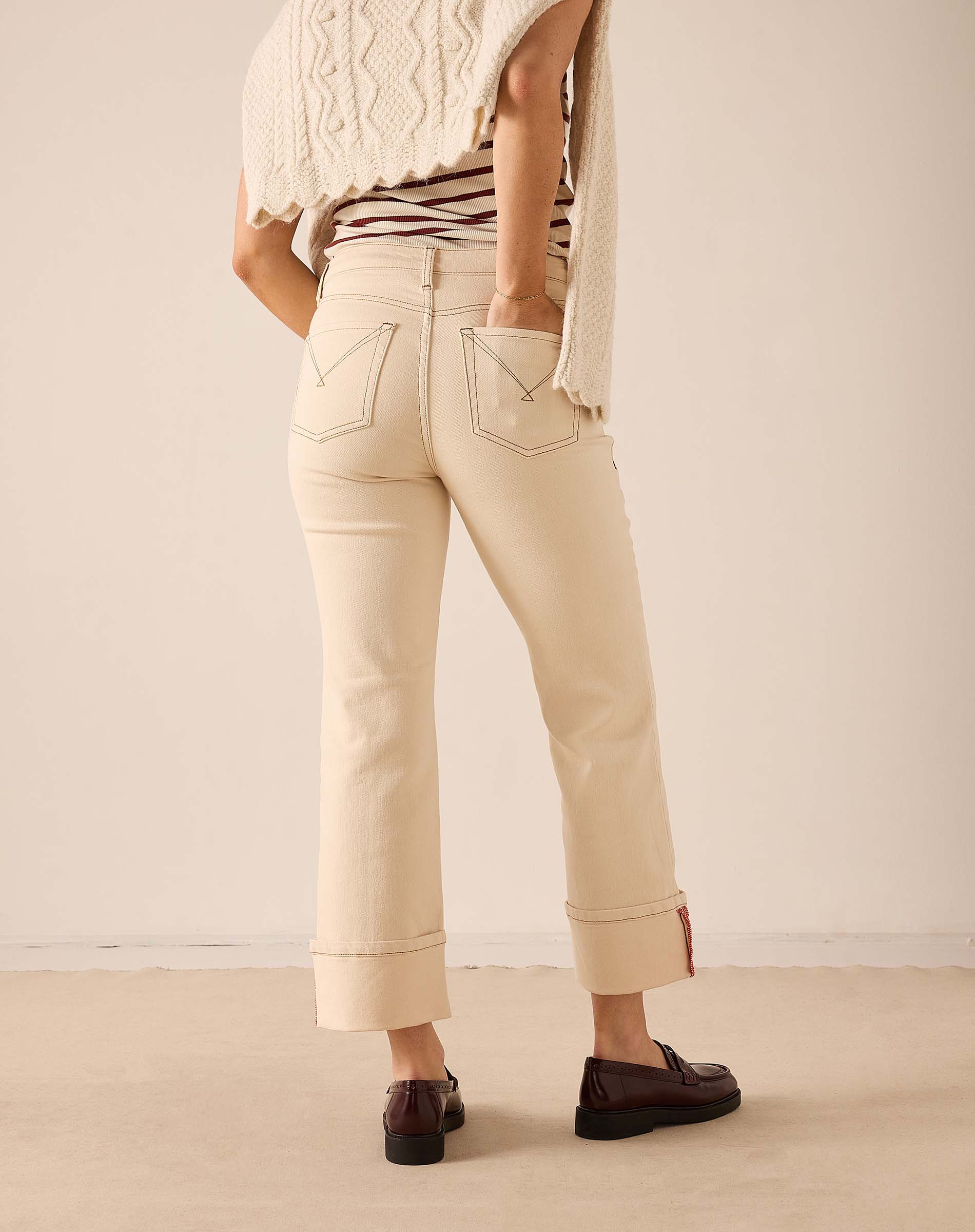 Oat colored straight leg pants in a cotton-blend fabric with stitched pocket details.