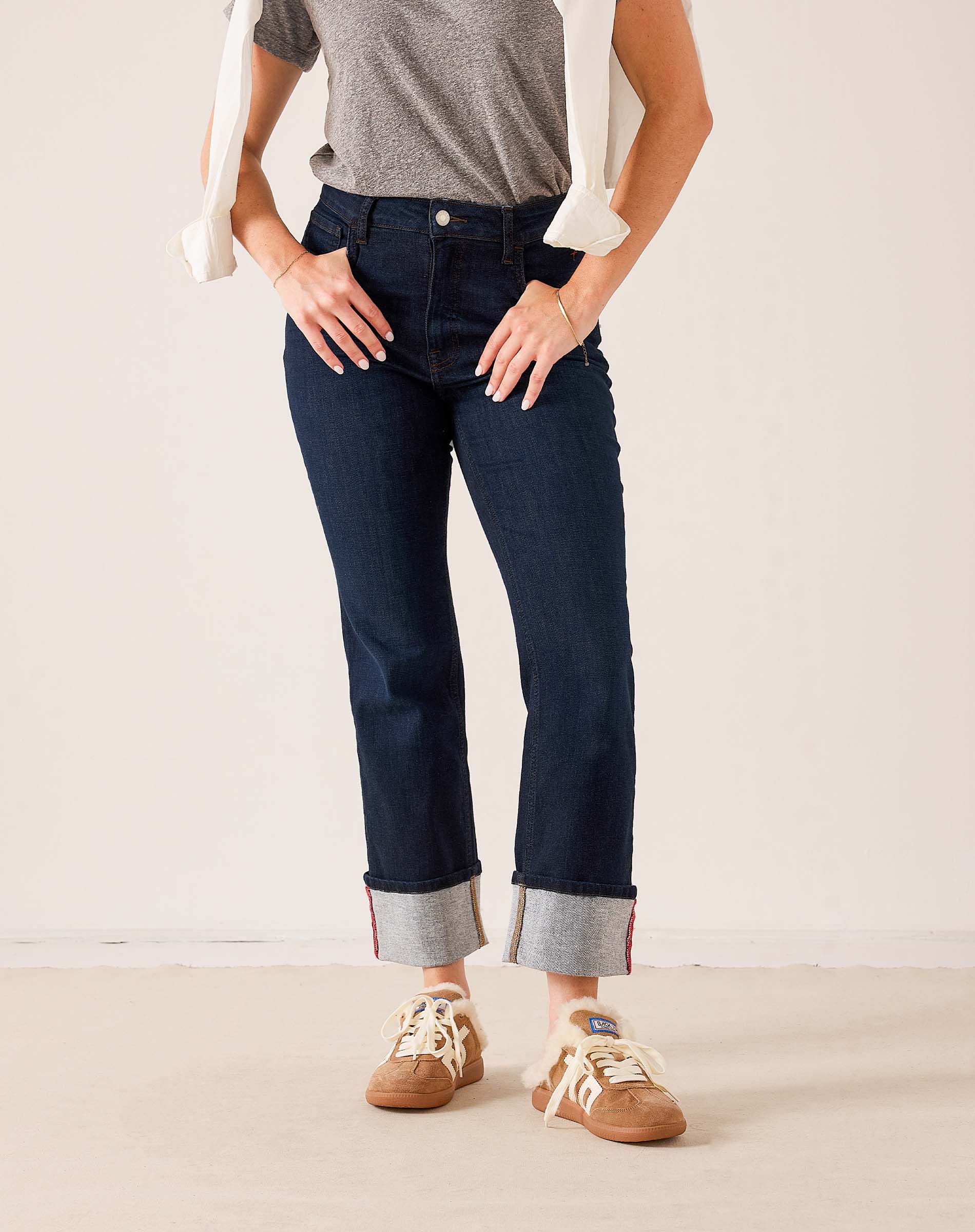 MERSEA ladies' travel-ready dark indigo blue straight-leg denim jeans with rolled cuffs and contrast stitching detail.