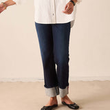 Dark blue straight-leg denim pants with cuffed hems.