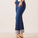 Dark wash denim straight-leg jeans with a contrasting grey and red stitched hem.