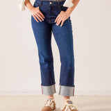 Mid-wash blue denim straight-leg jeans with contrast red stitching and cuffed hems.