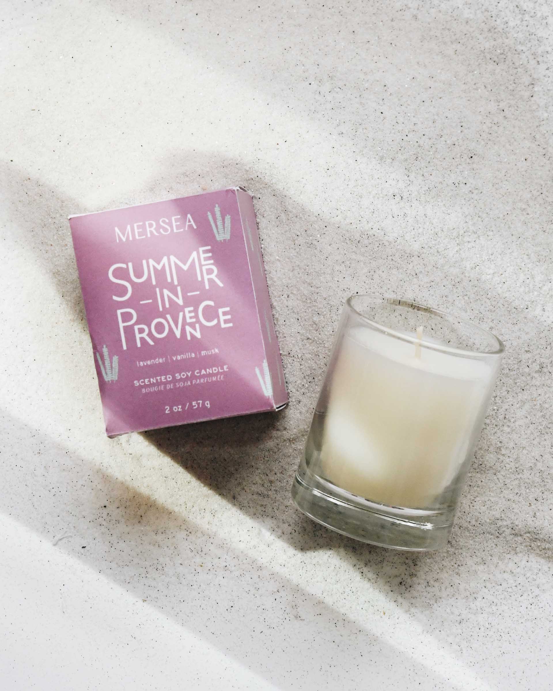 summer in provence votive candle laying in sand